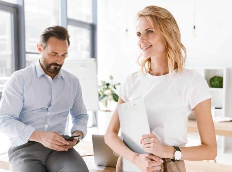 confident-man-manager-using-mobile-phone-PKUB4RV@2x